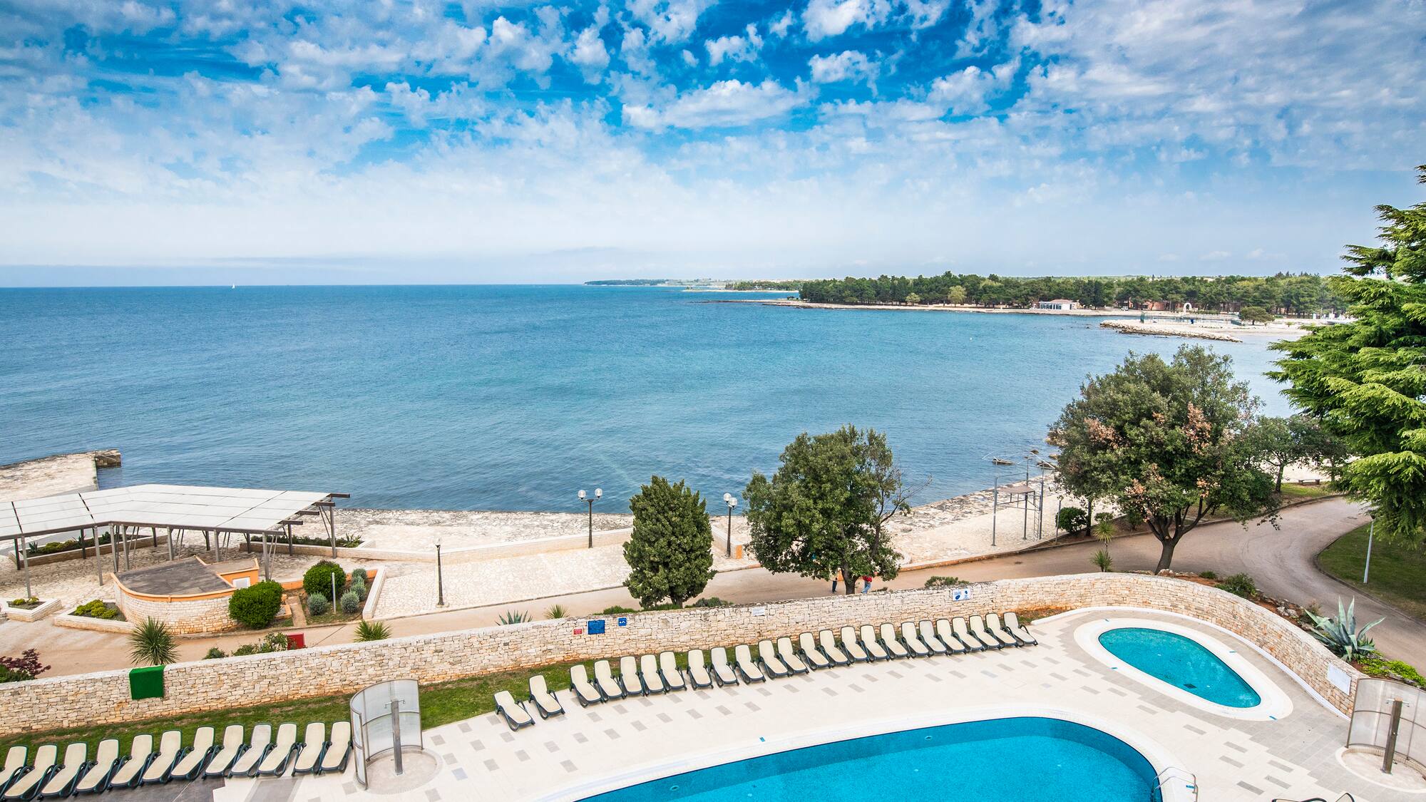 a pool next to a body of water