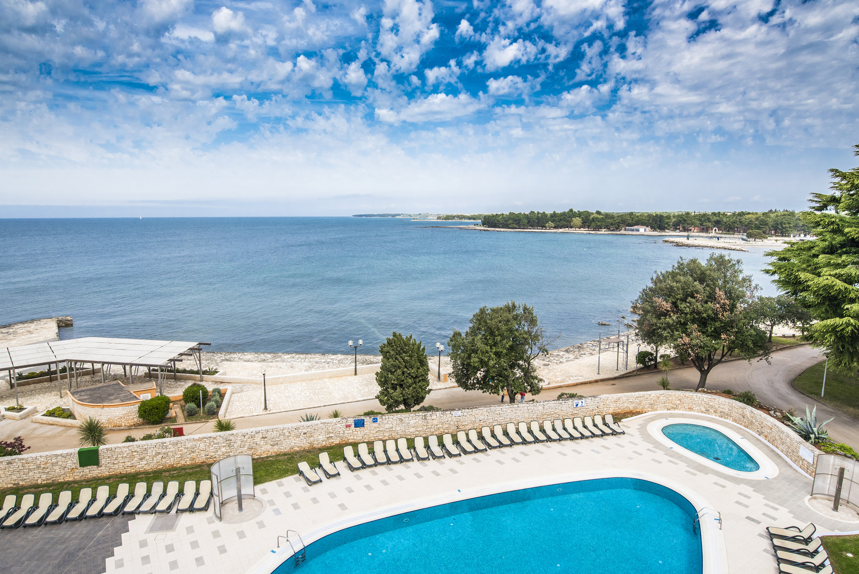 a pool next to a body of water