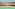 Aerial tropical beach resort, turquoise sea, white sand, coastal city background.