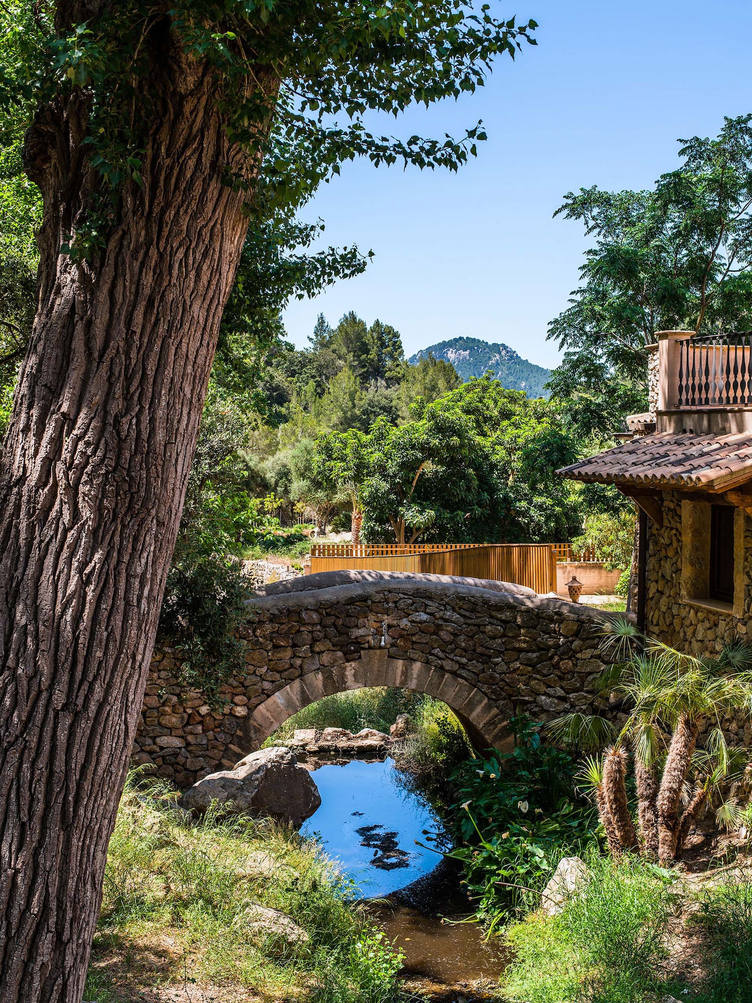 a stone bridge over a stream