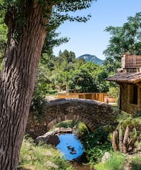 a stone bridge over a stream