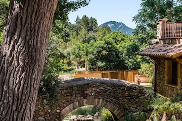 a stone bridge over a stream