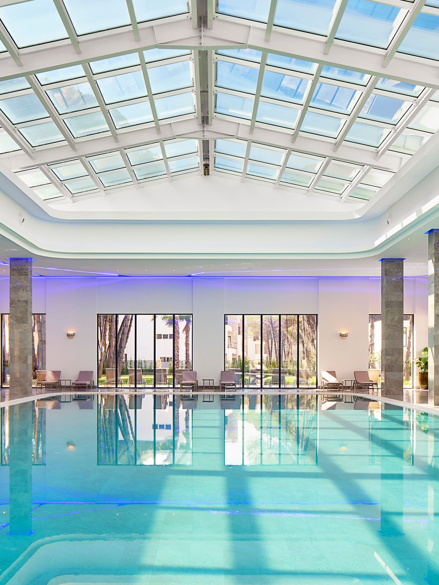 a indoor pool with a large roof