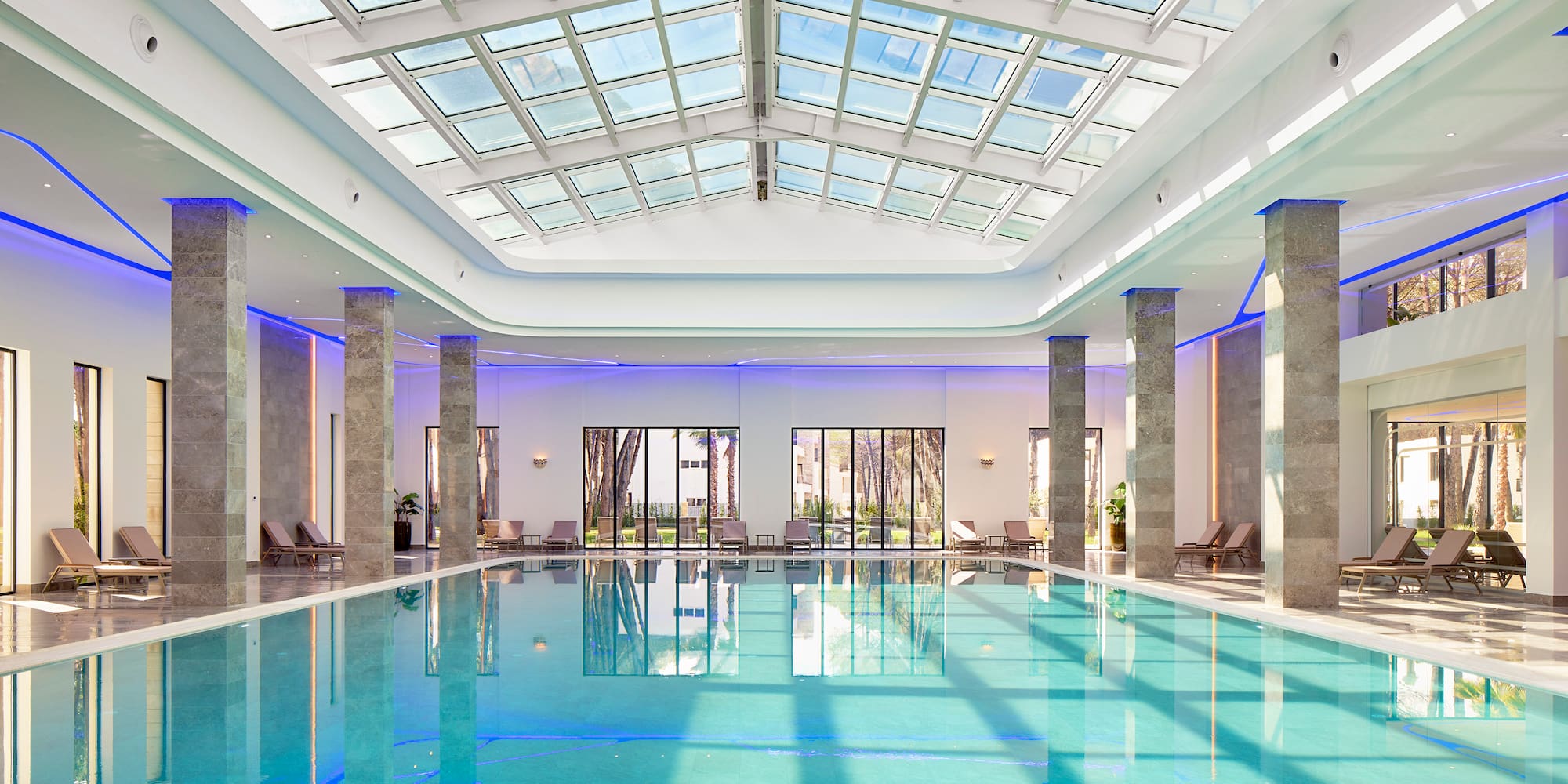 a indoor pool with a large roof