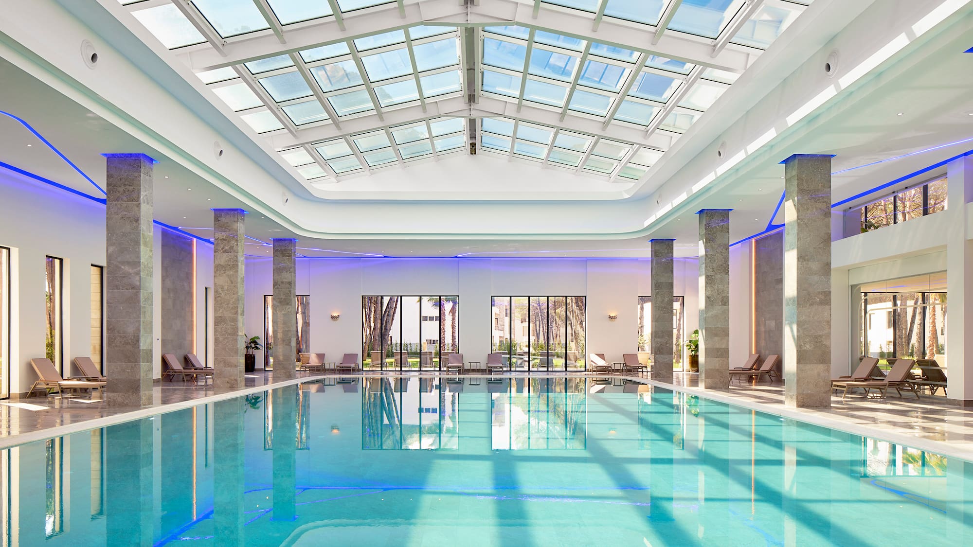 a indoor pool with a large roof