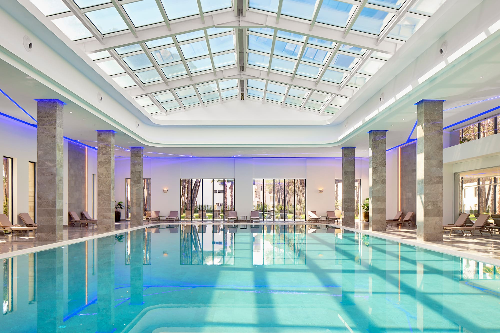 a indoor pool with a large roof