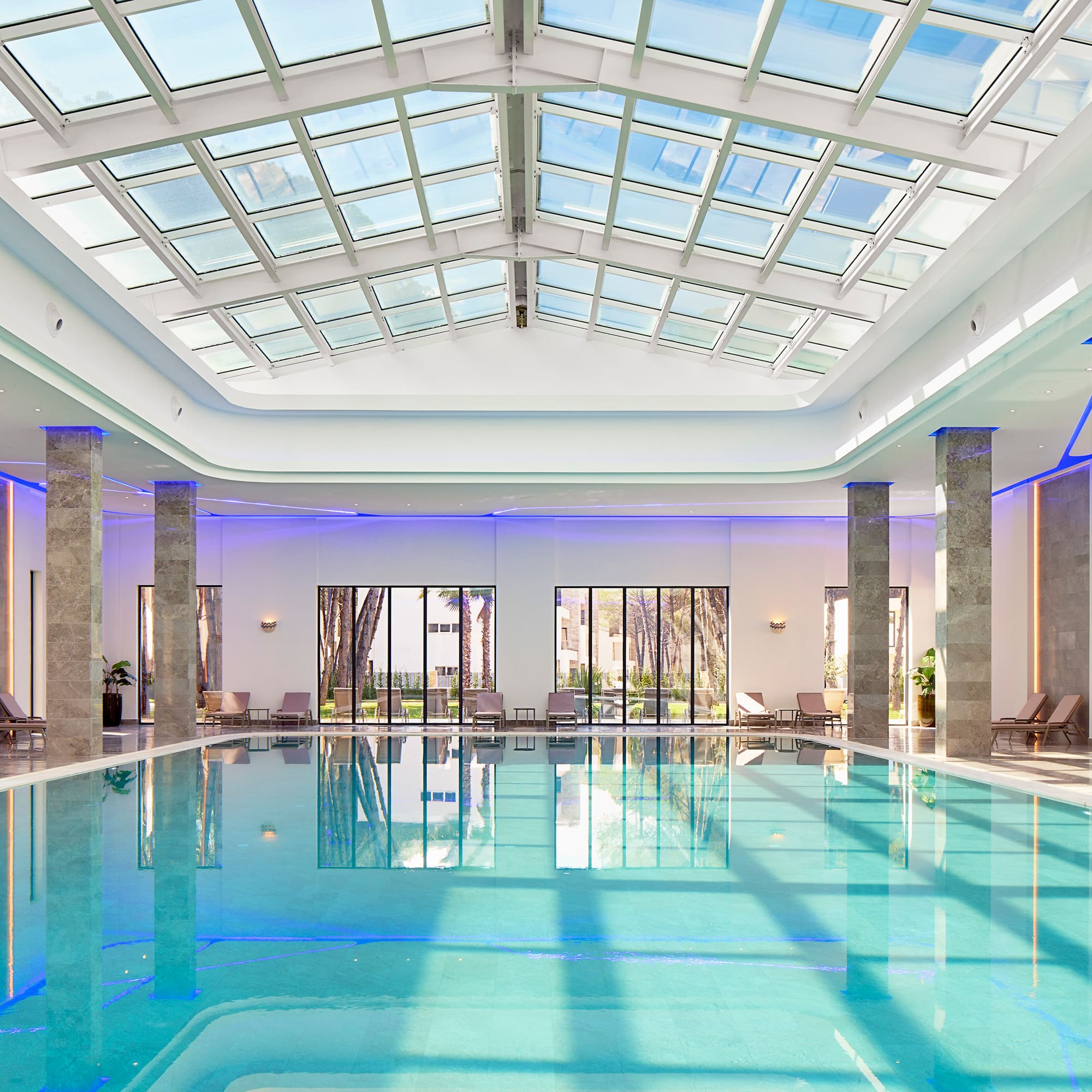 a indoor pool with a large roof