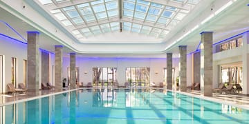 a indoor pool with a large roof