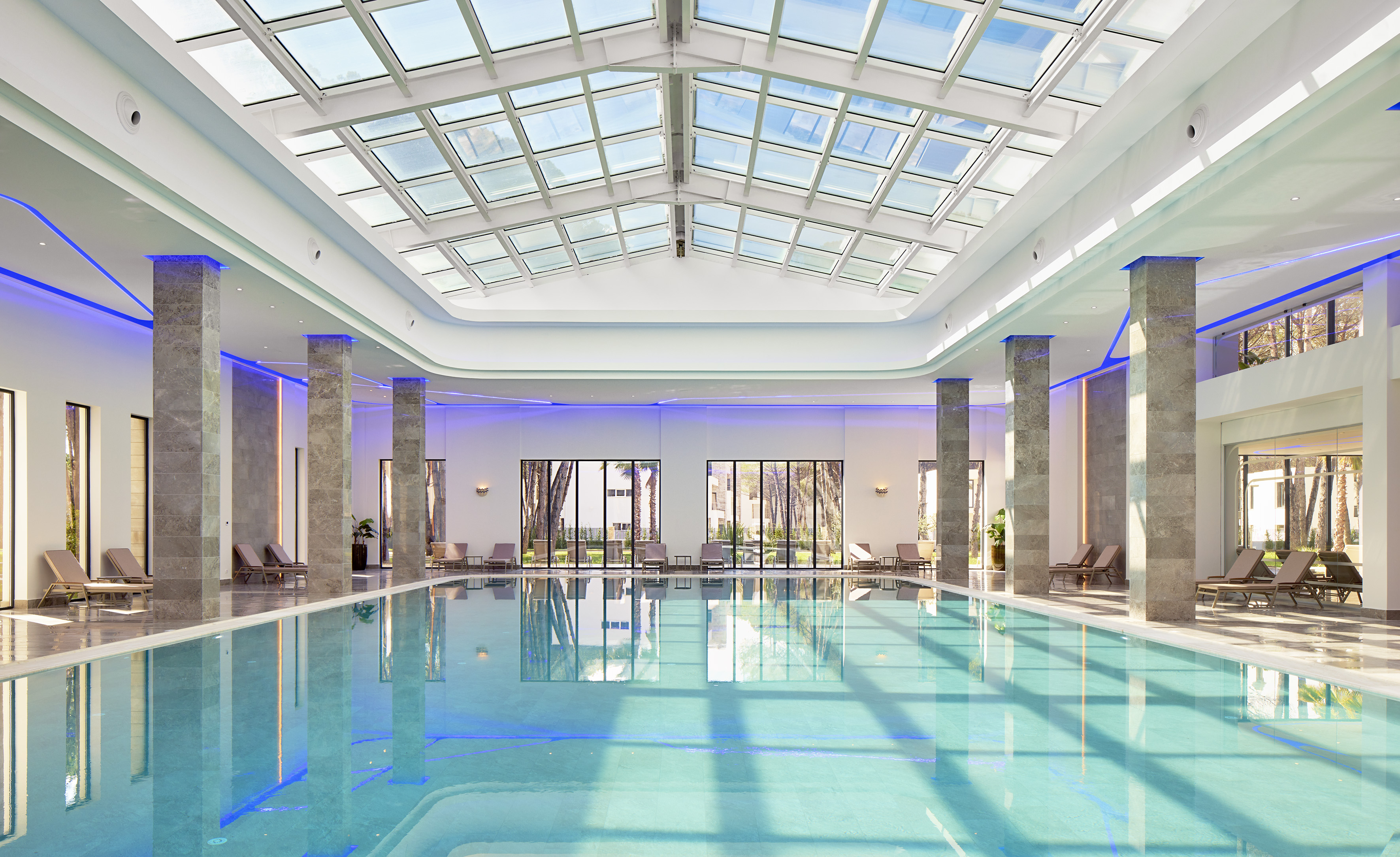 a indoor pool with a large roof