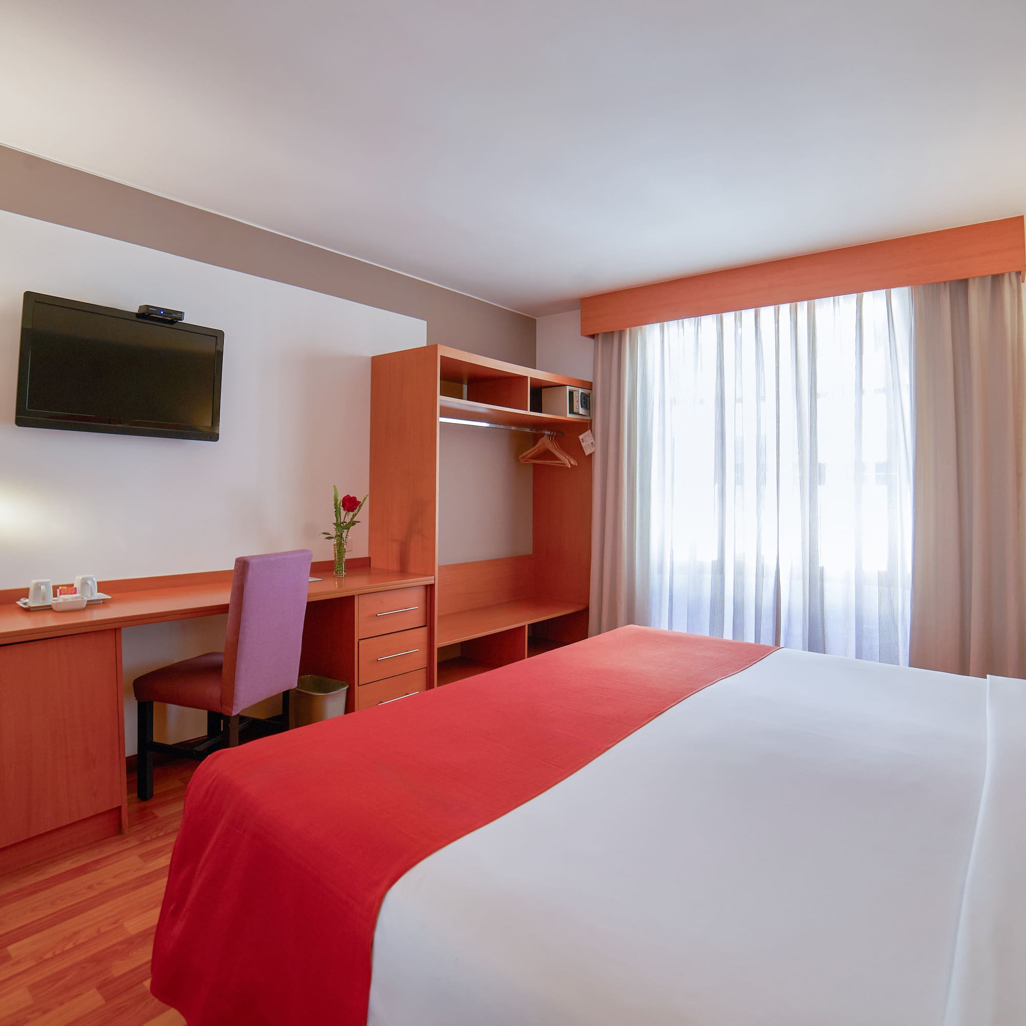 a room with a bed and a desk