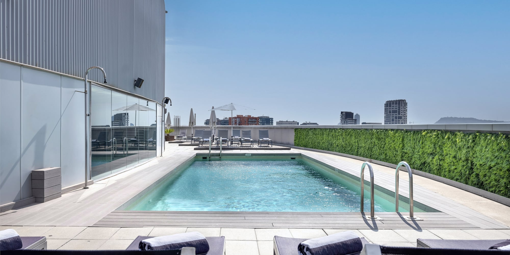 a pool with chairs and a deck