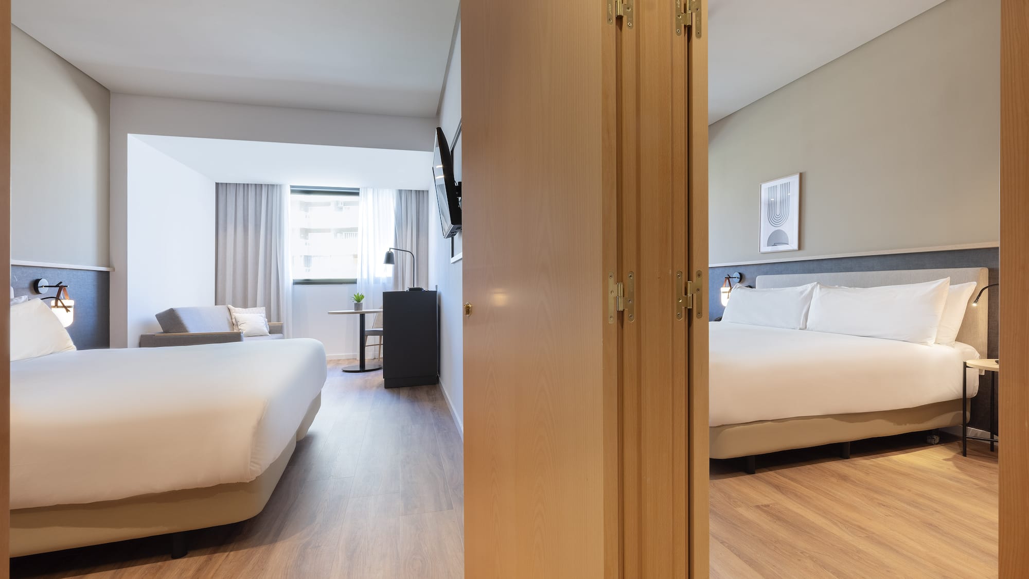 a room with a bed and a door open