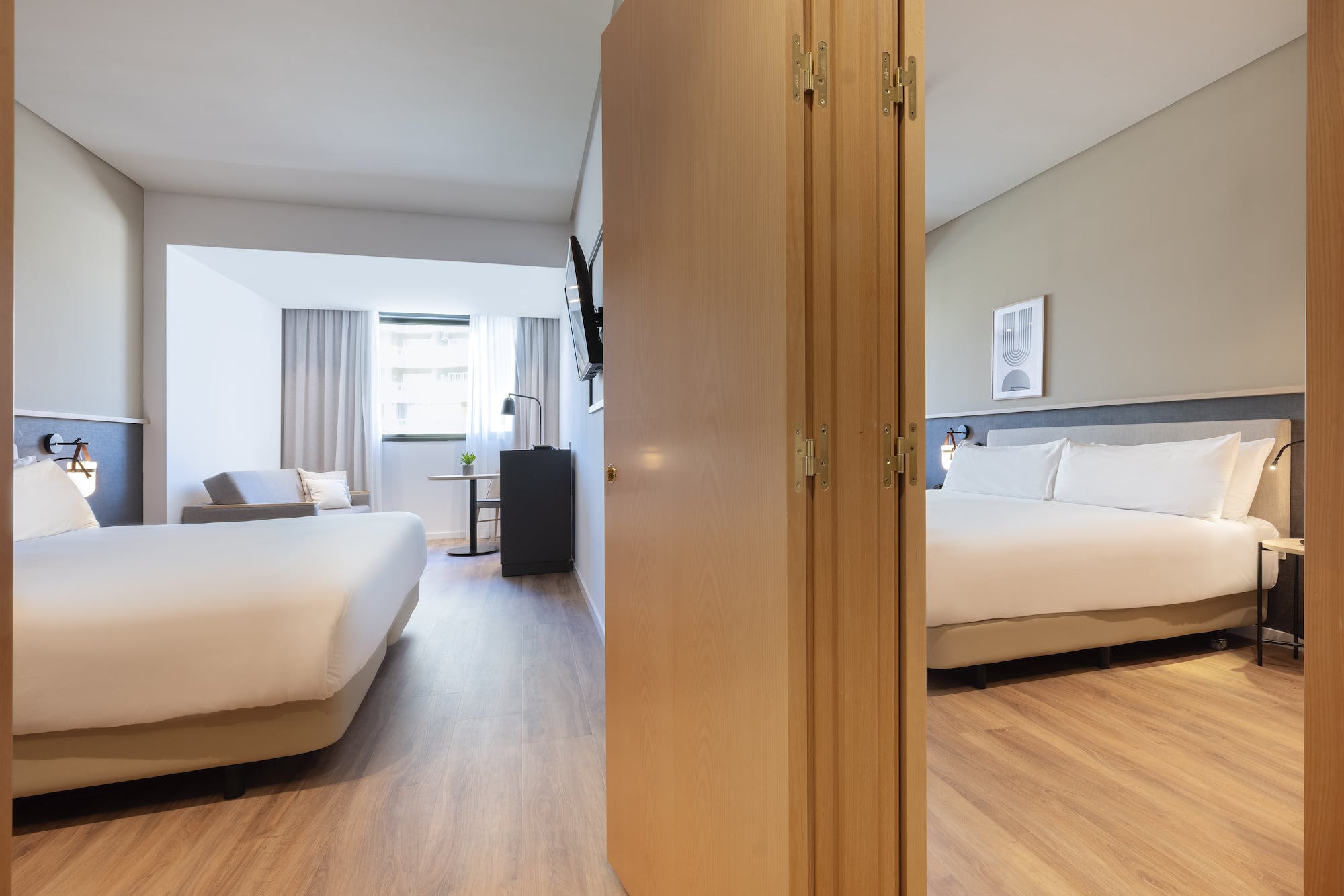 a room with a bed and a door open