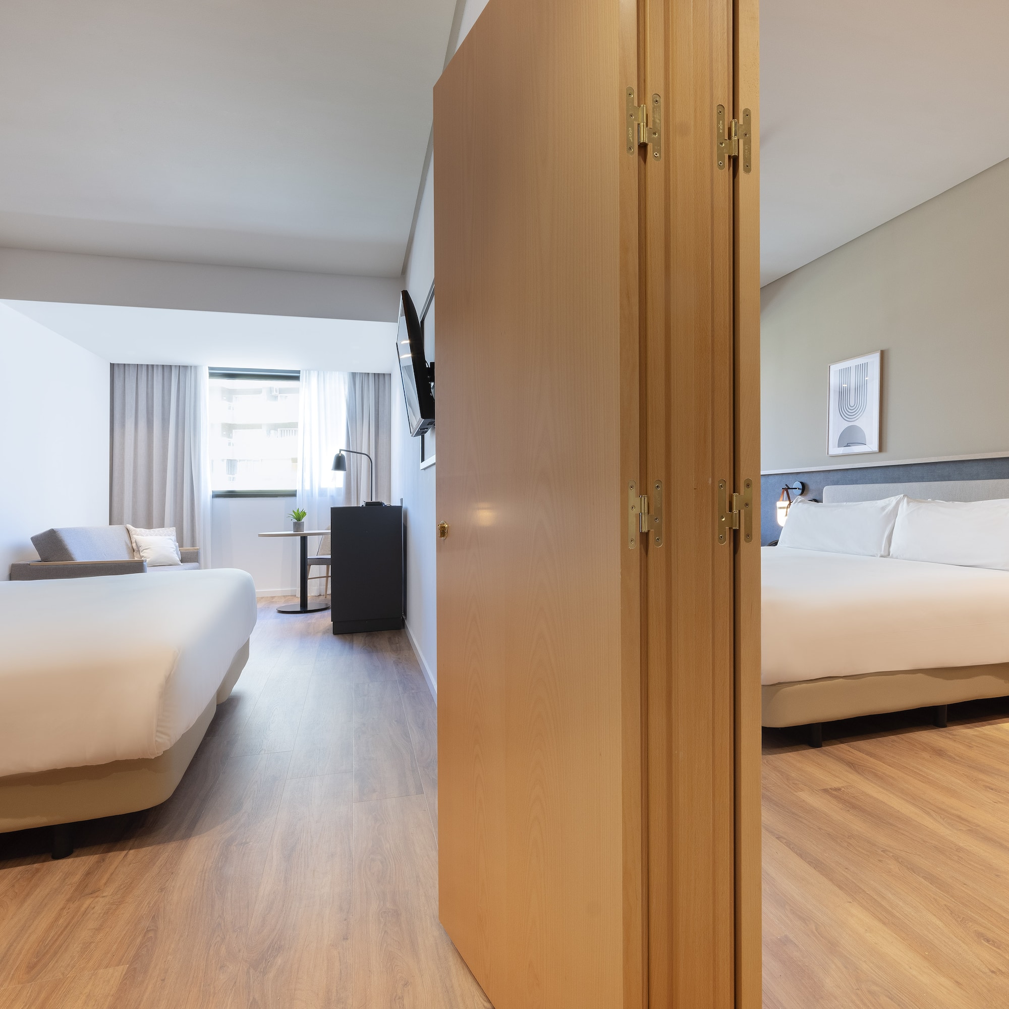 a room with a bed and a door open