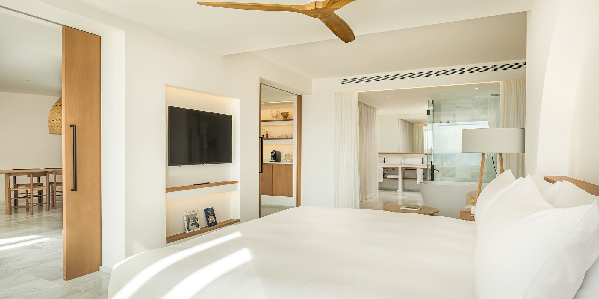 a room with a bed and a television