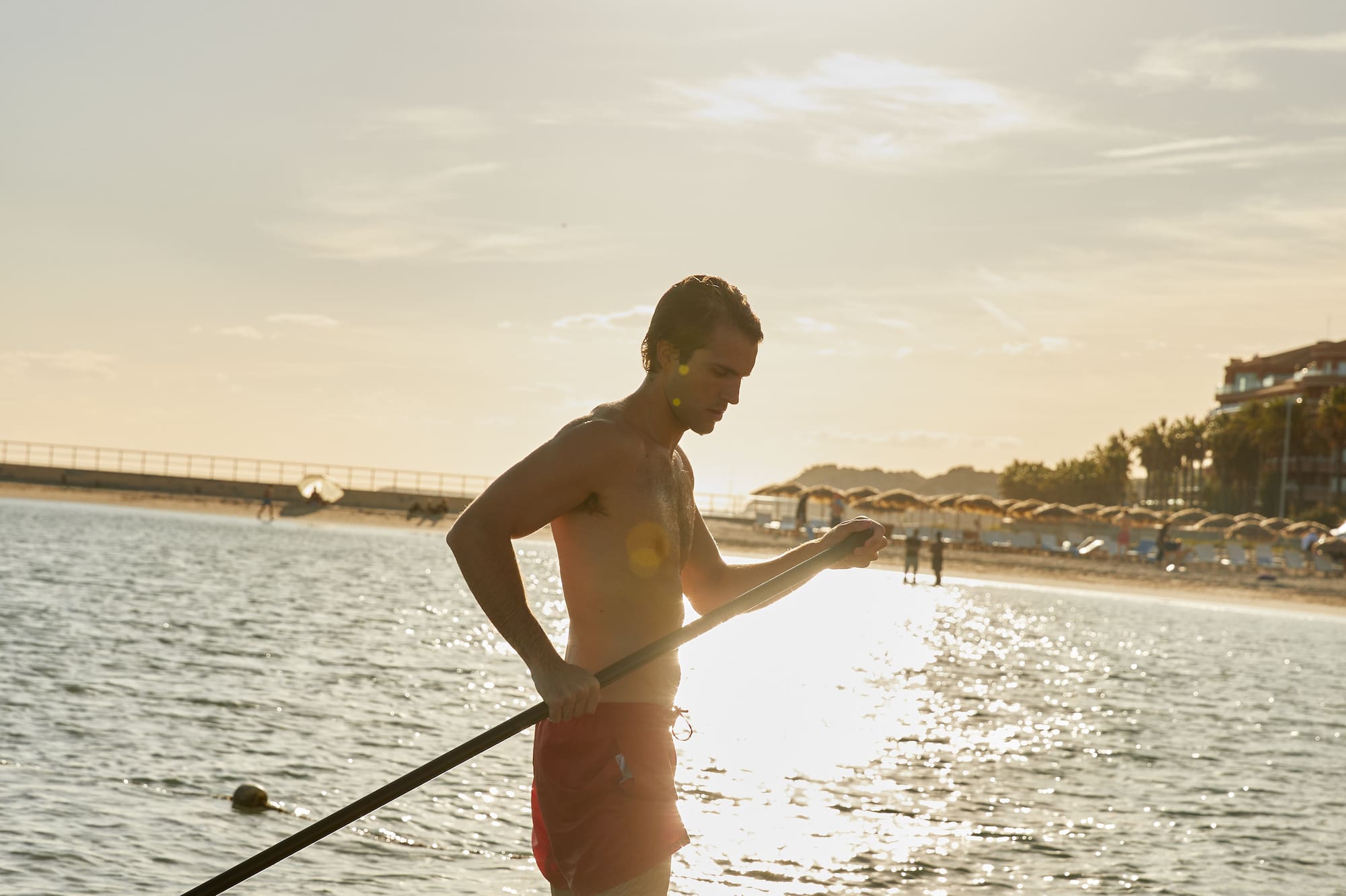 a man holding a rope in the water