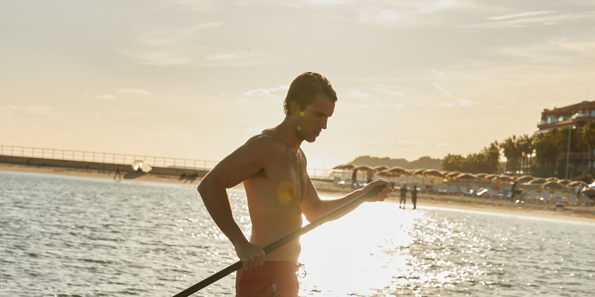 a man holding a rope in the water