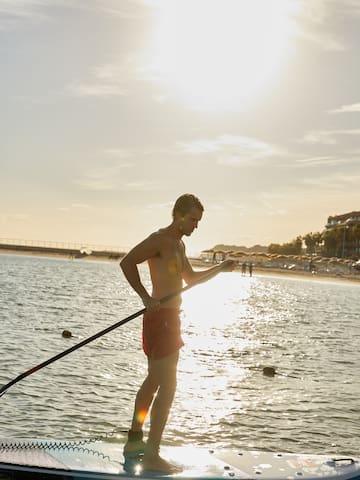a man holding a rope in the water
