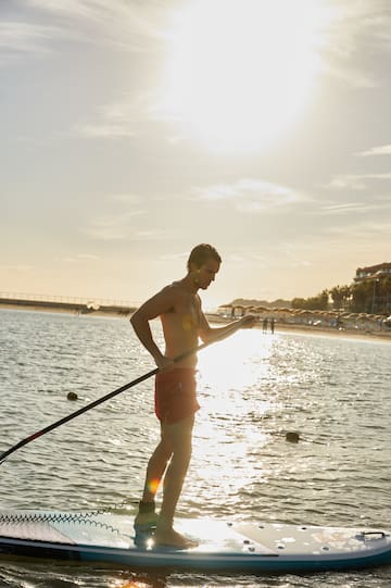 a man holding a rope in the water