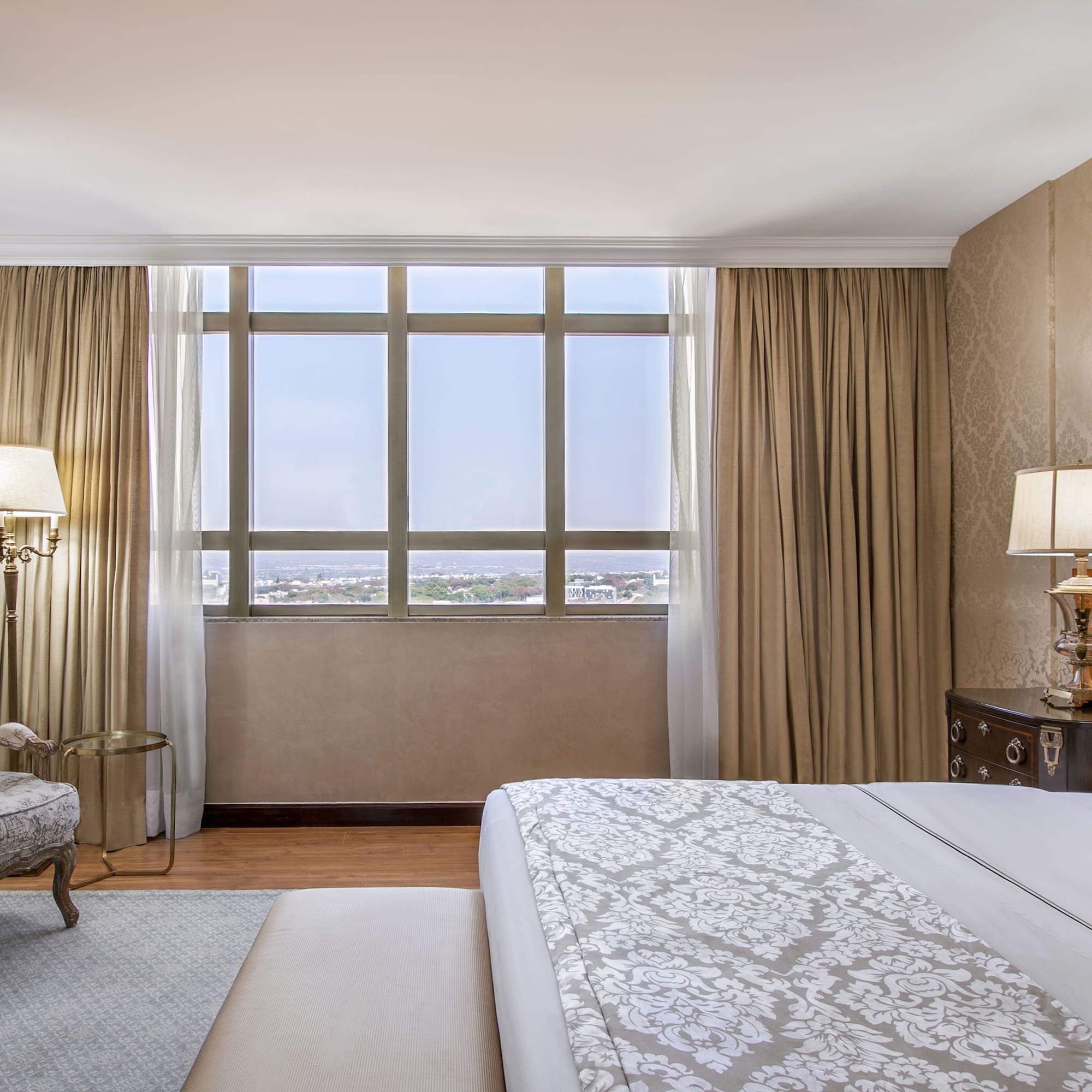 a bedroom with a bed and a chair