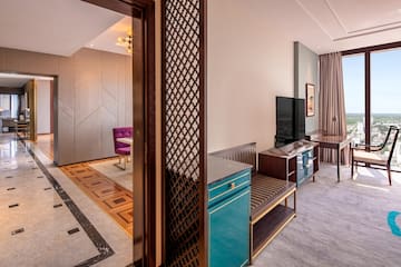 a room with a tv and a table