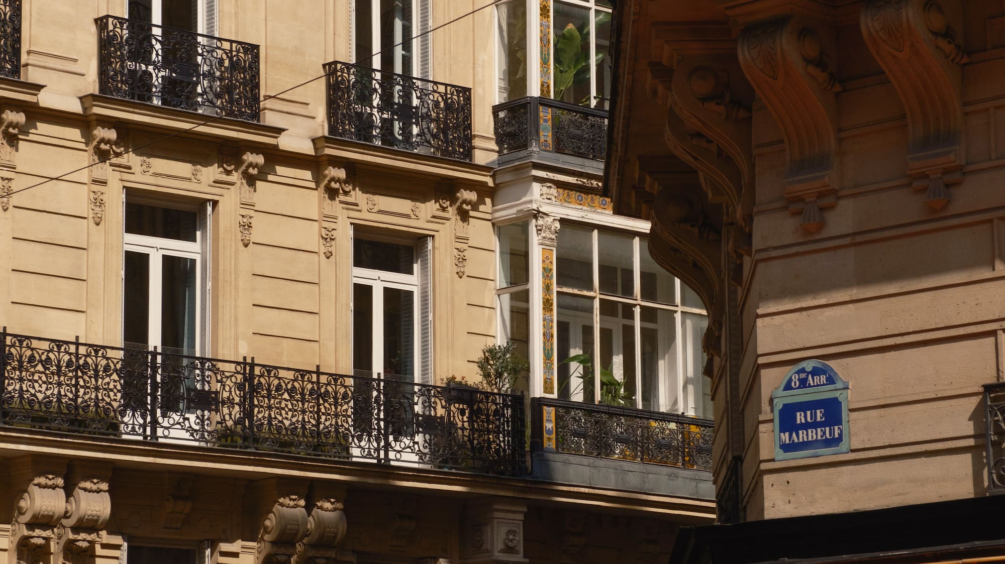 a building with a red awning