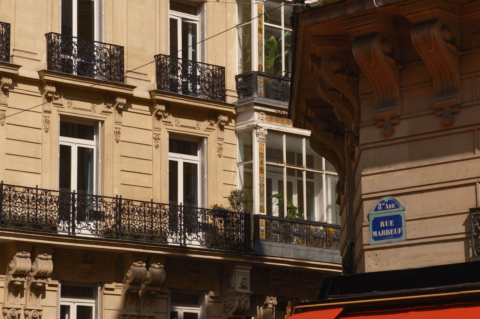 a building with a red awning