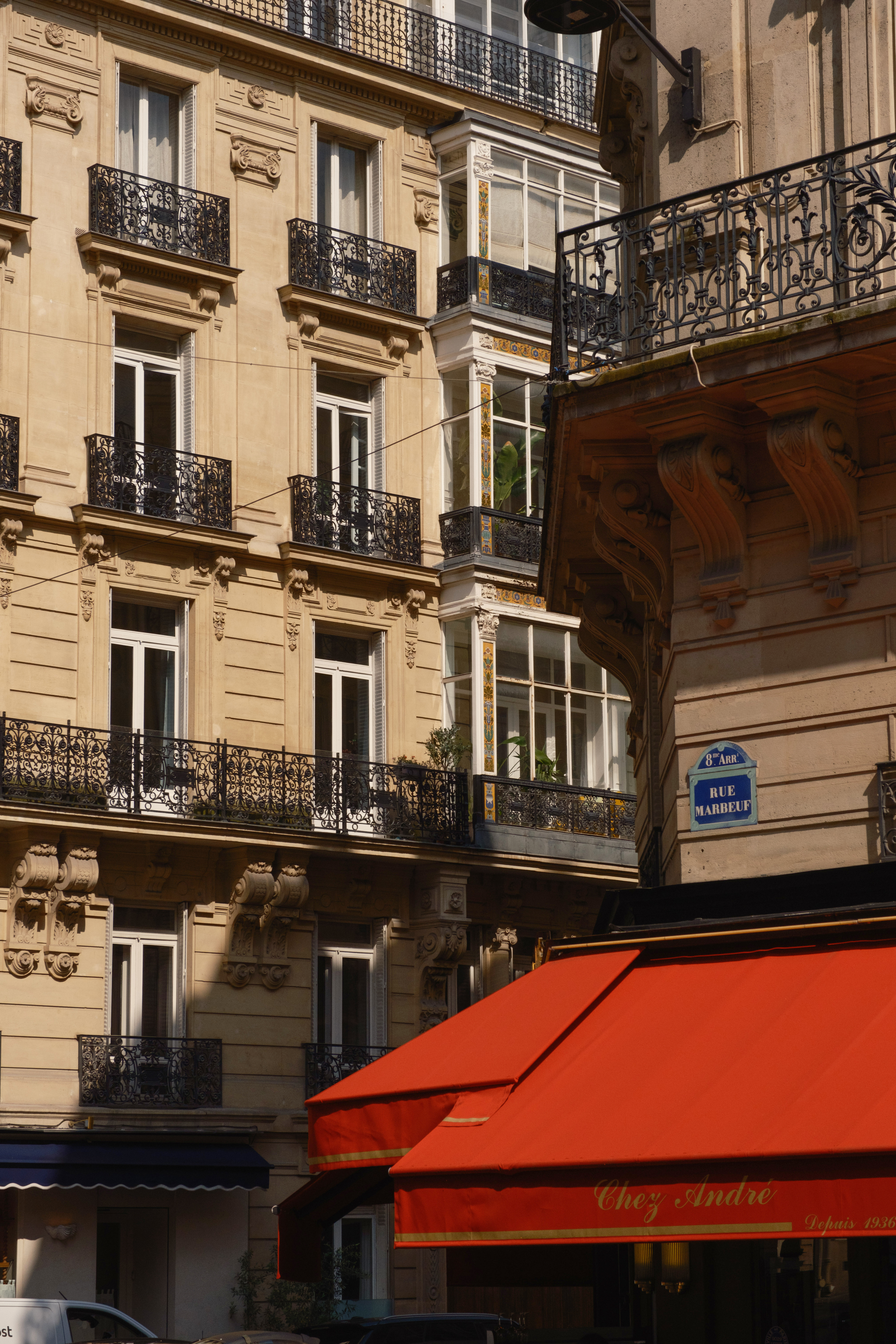 a building with a red awning