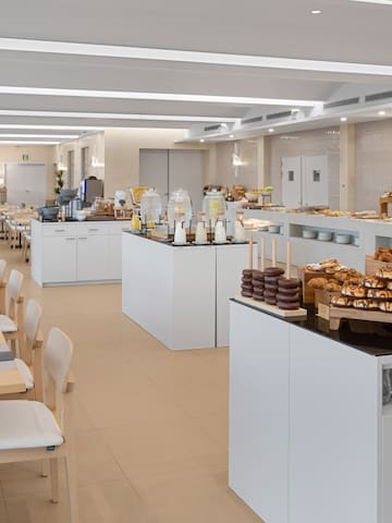 a large room with many tables and chairs