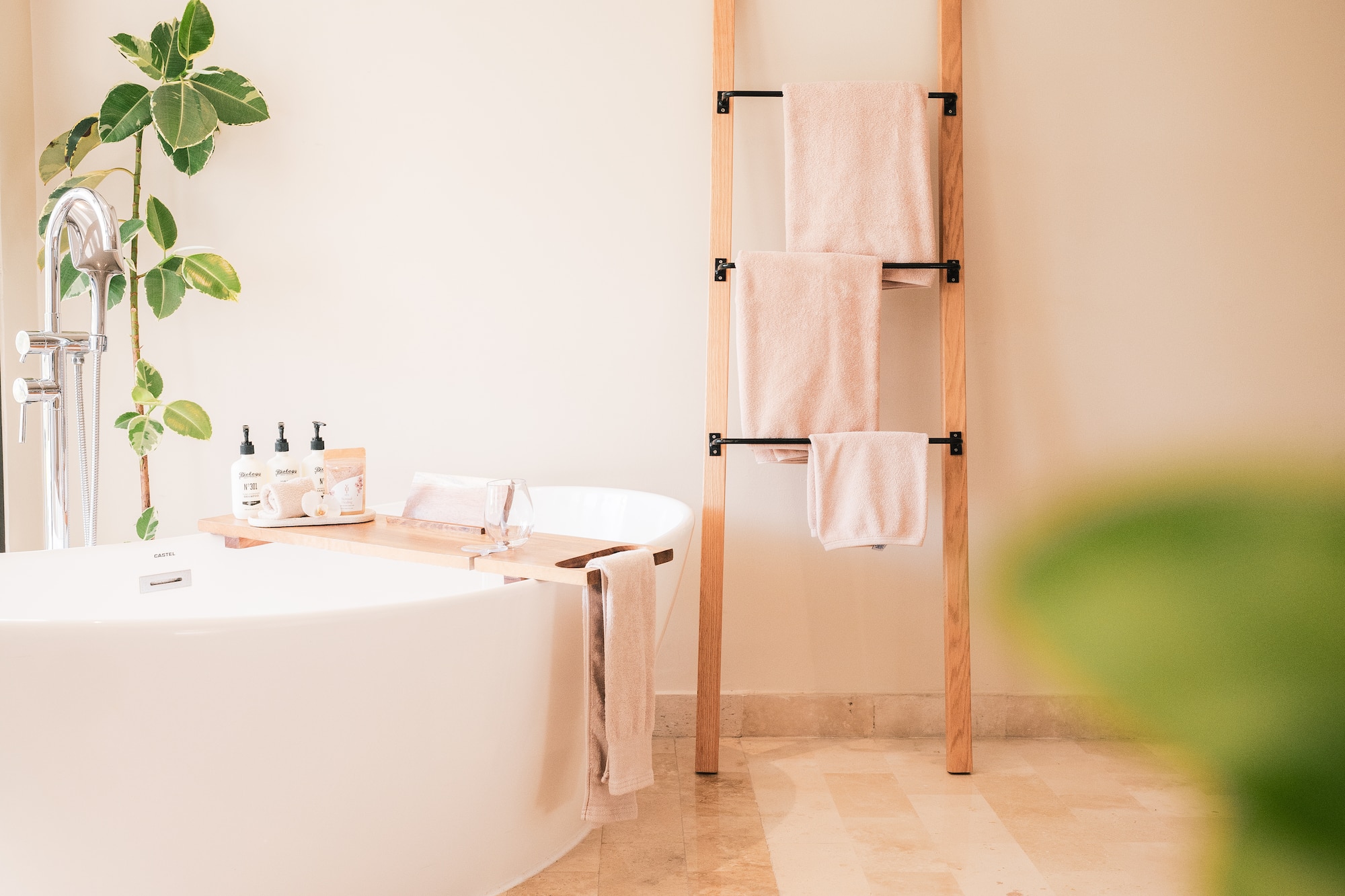 a bathroom with a tub and a towel rack
