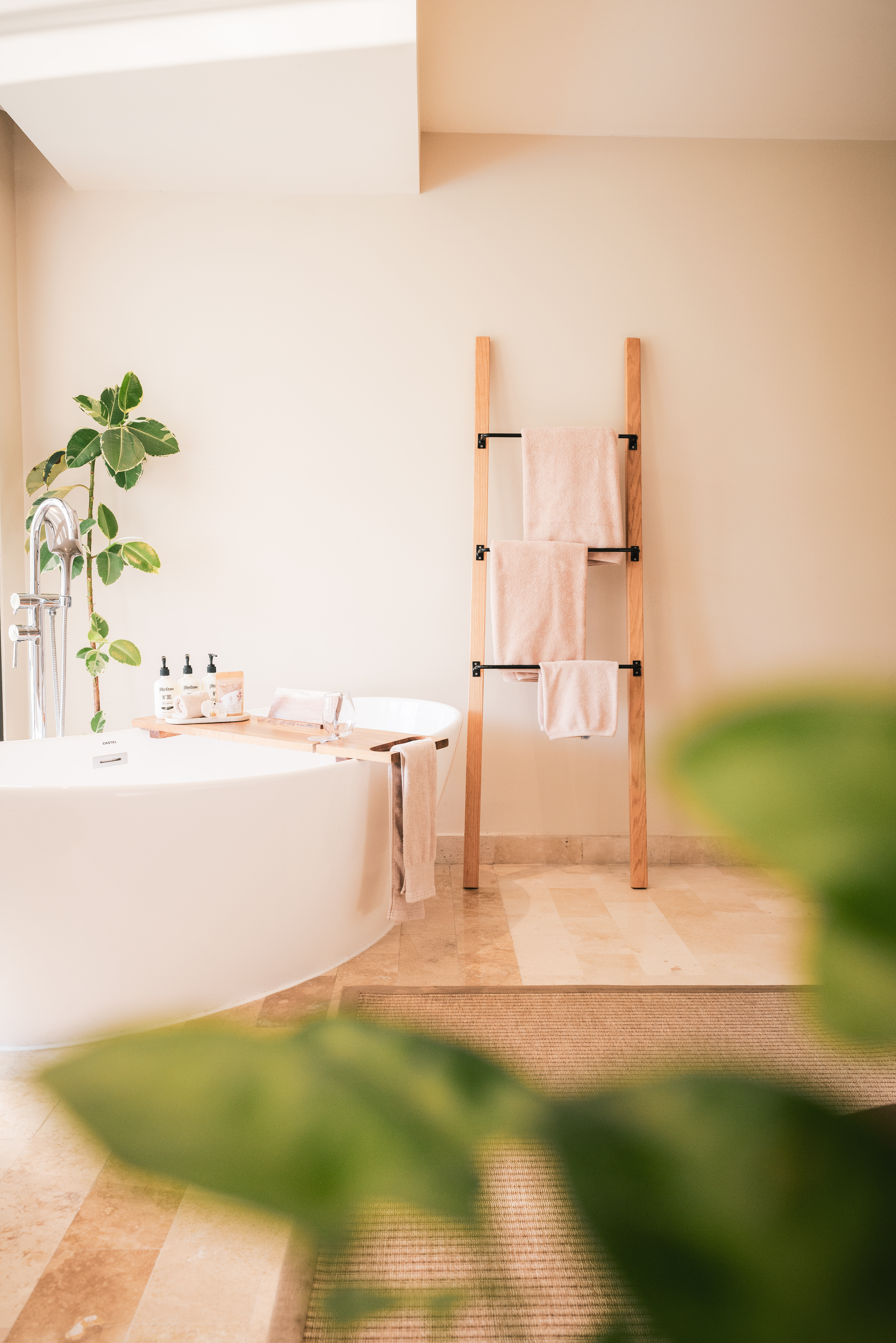 a bathroom with a tub and a towel rack