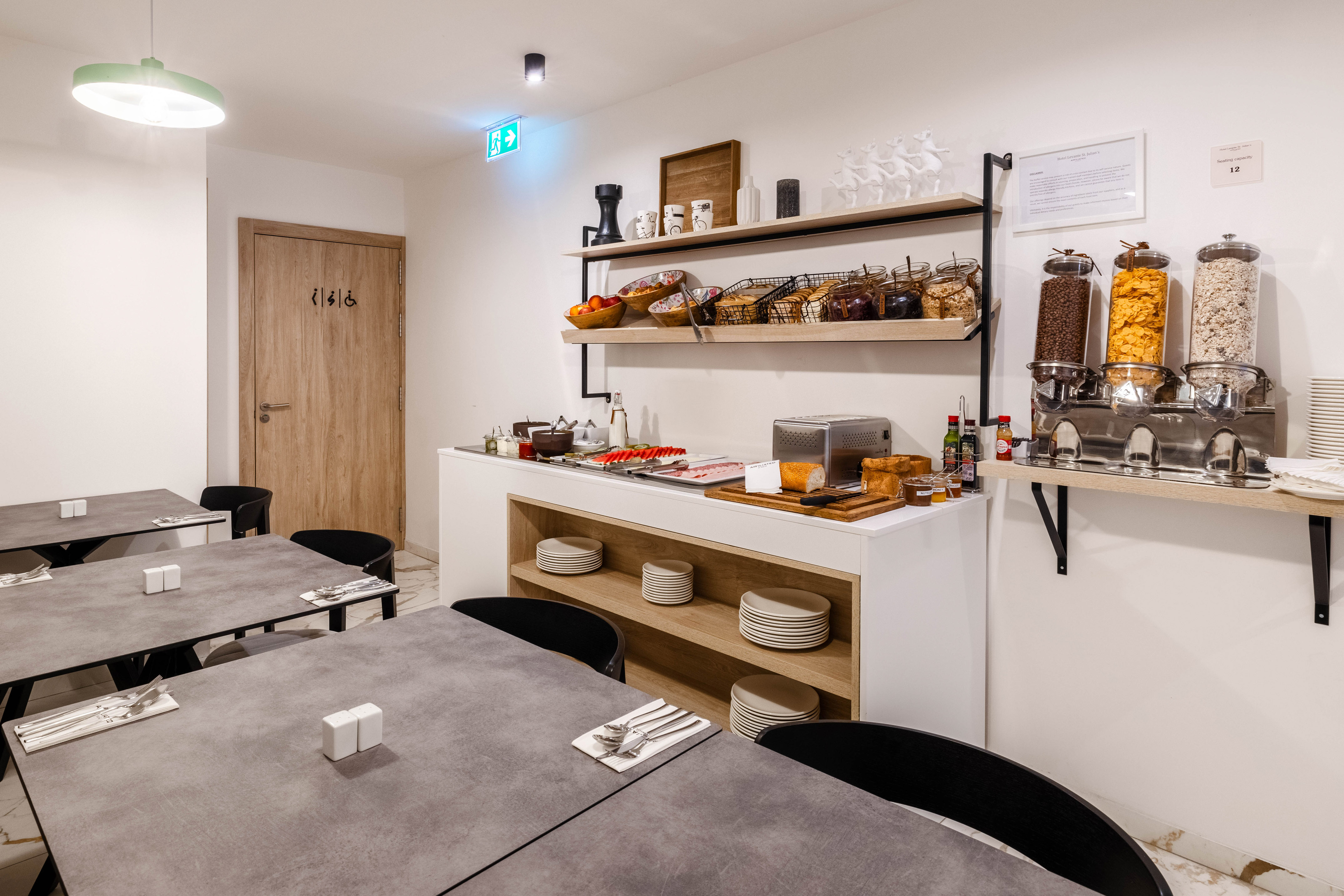 Minimalist gray surface with subtle bright top edge and dark overhead detail.