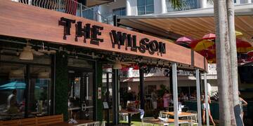 a restaurant with tables and chairs outside