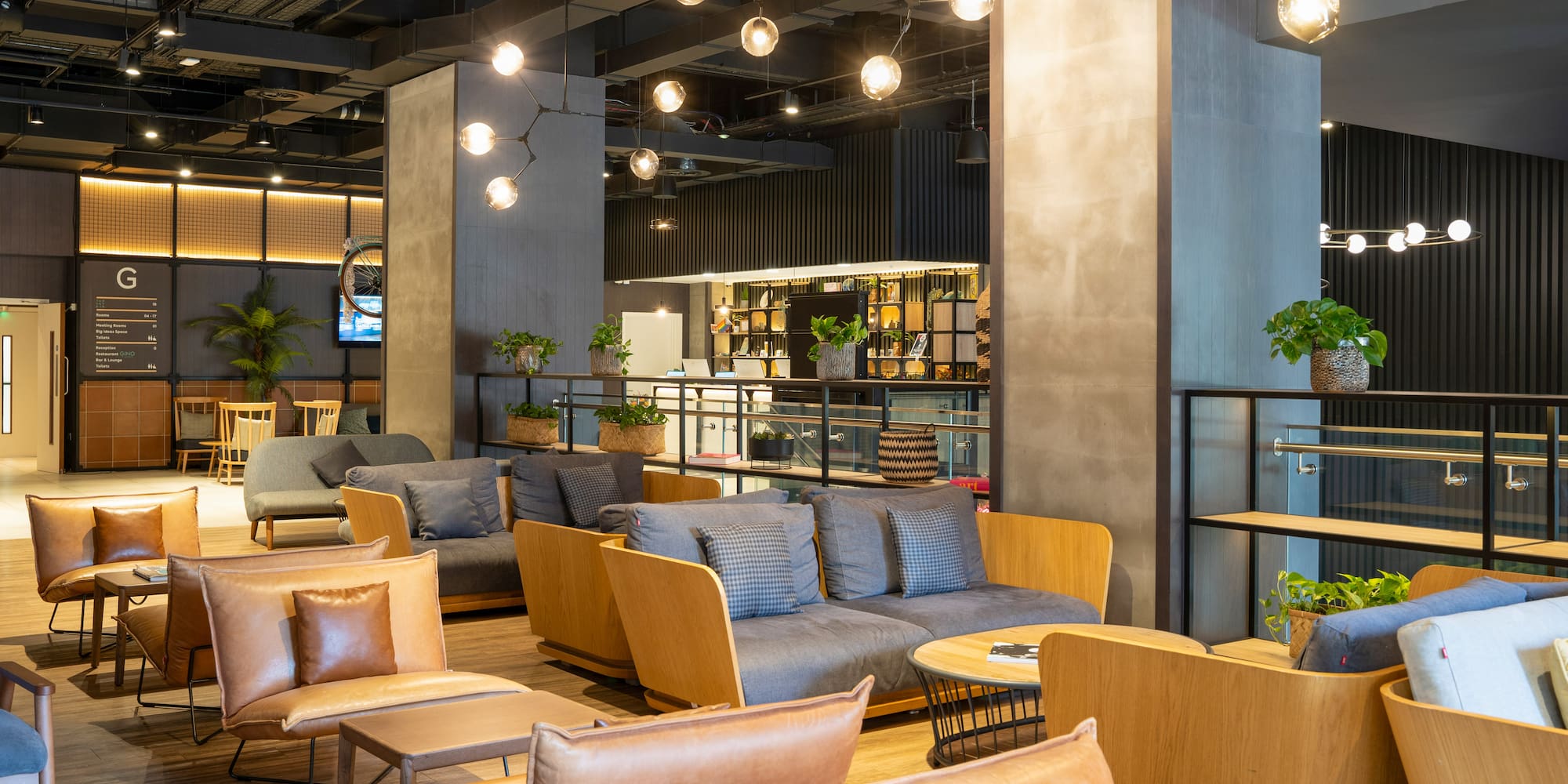 a room with a couch and chairs