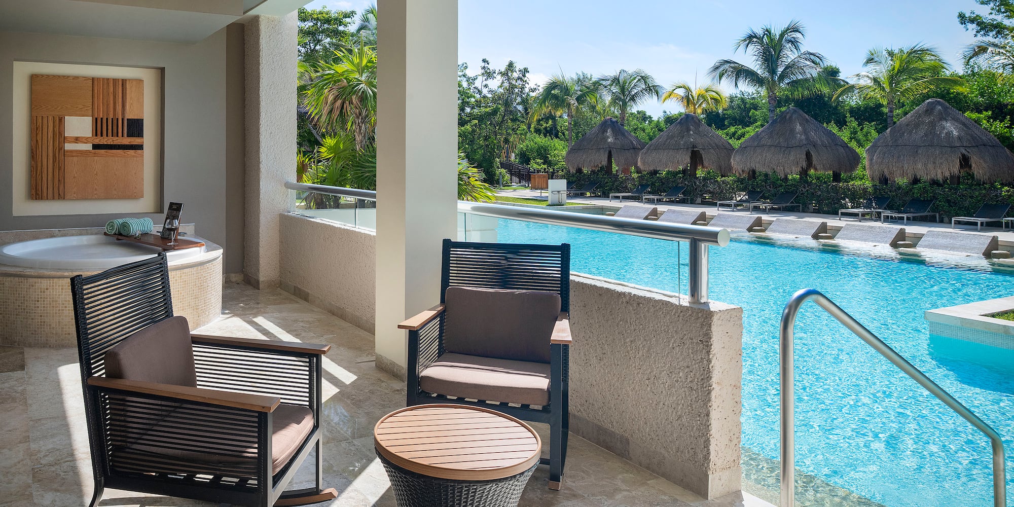 a pool with chairs and a table