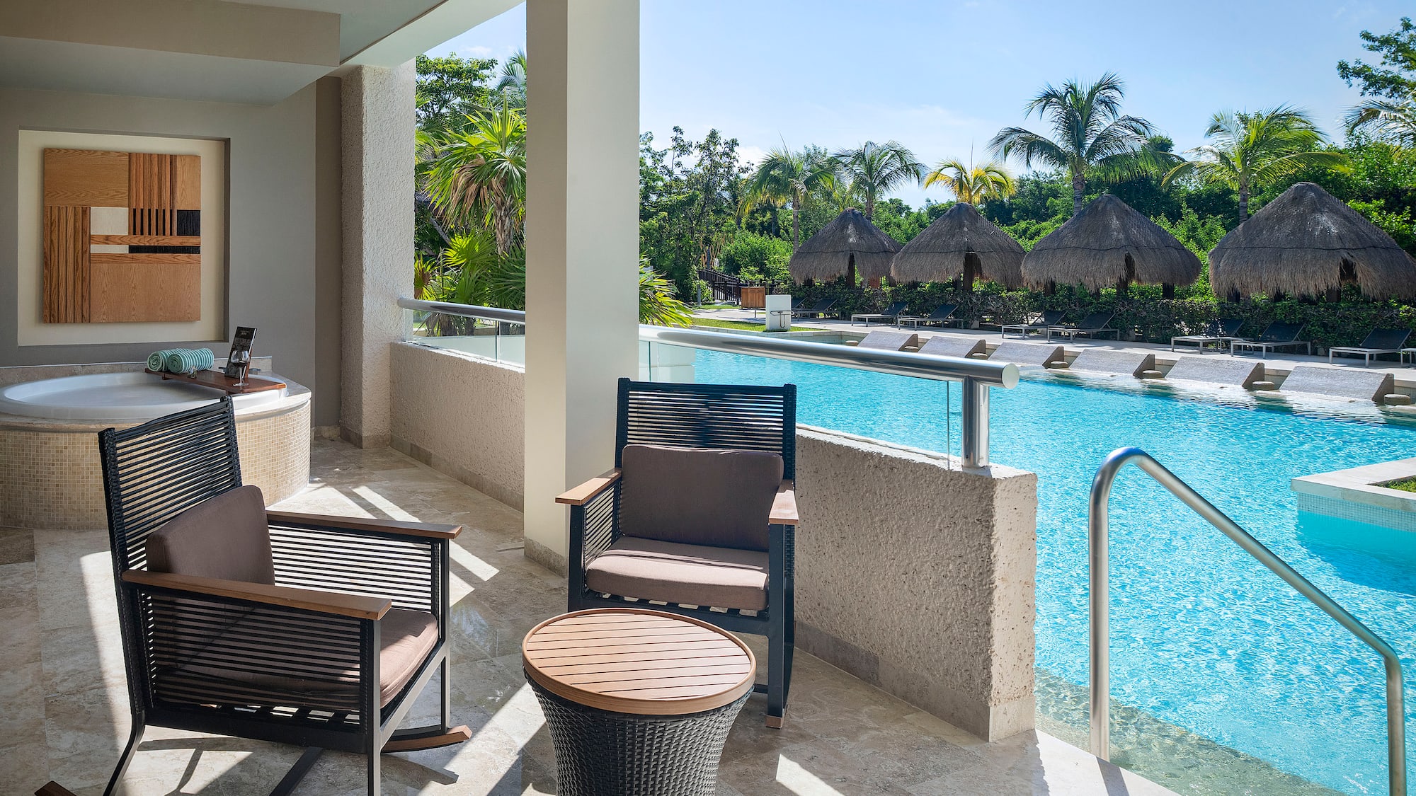 a pool with chairs and a table