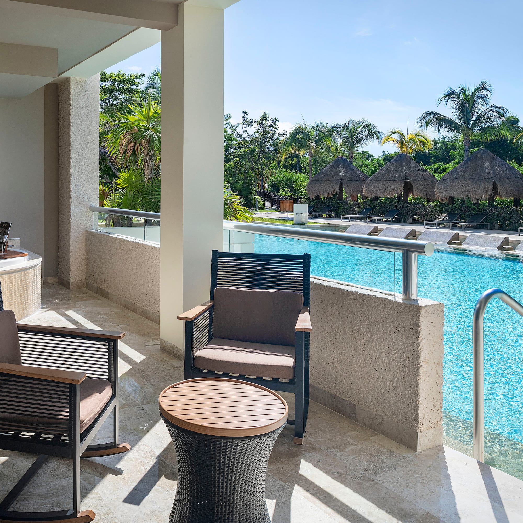 a pool with chairs and a table