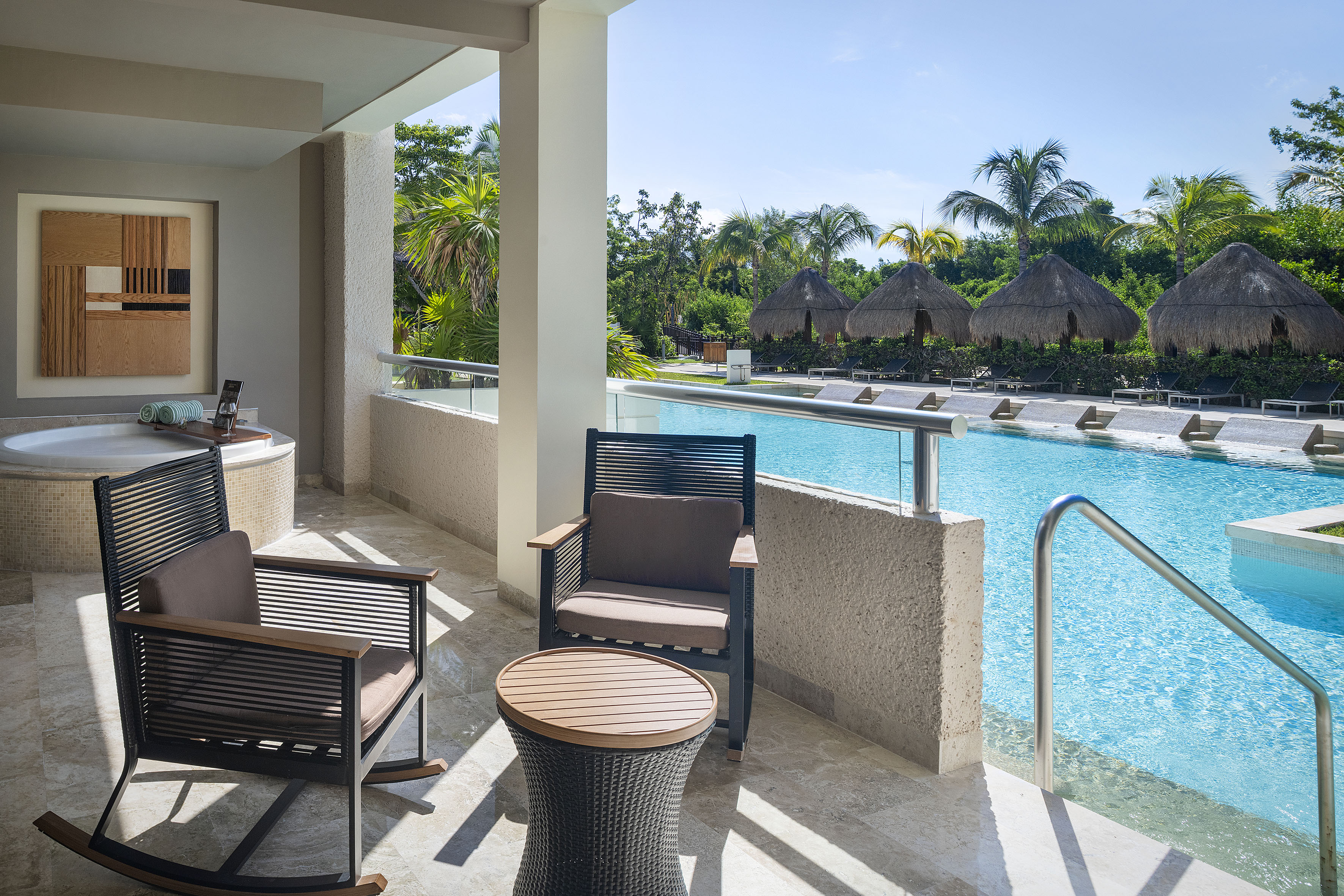 a pool with chairs and a table