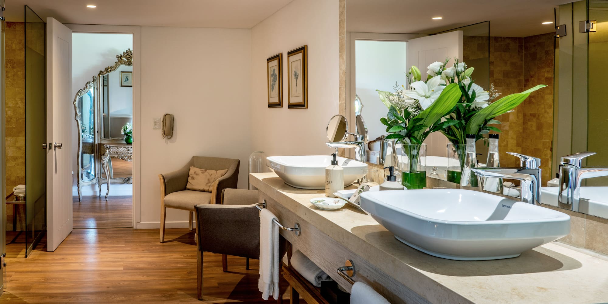 a bathroom with a large mirror and sink