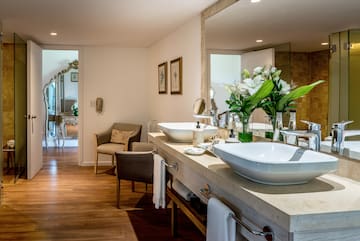 a bathroom with a large mirror and sink