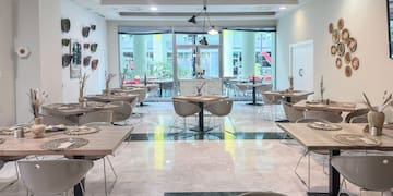 a room with tables and chairs