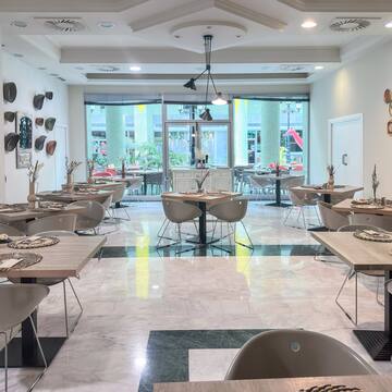 a room with tables and chairs