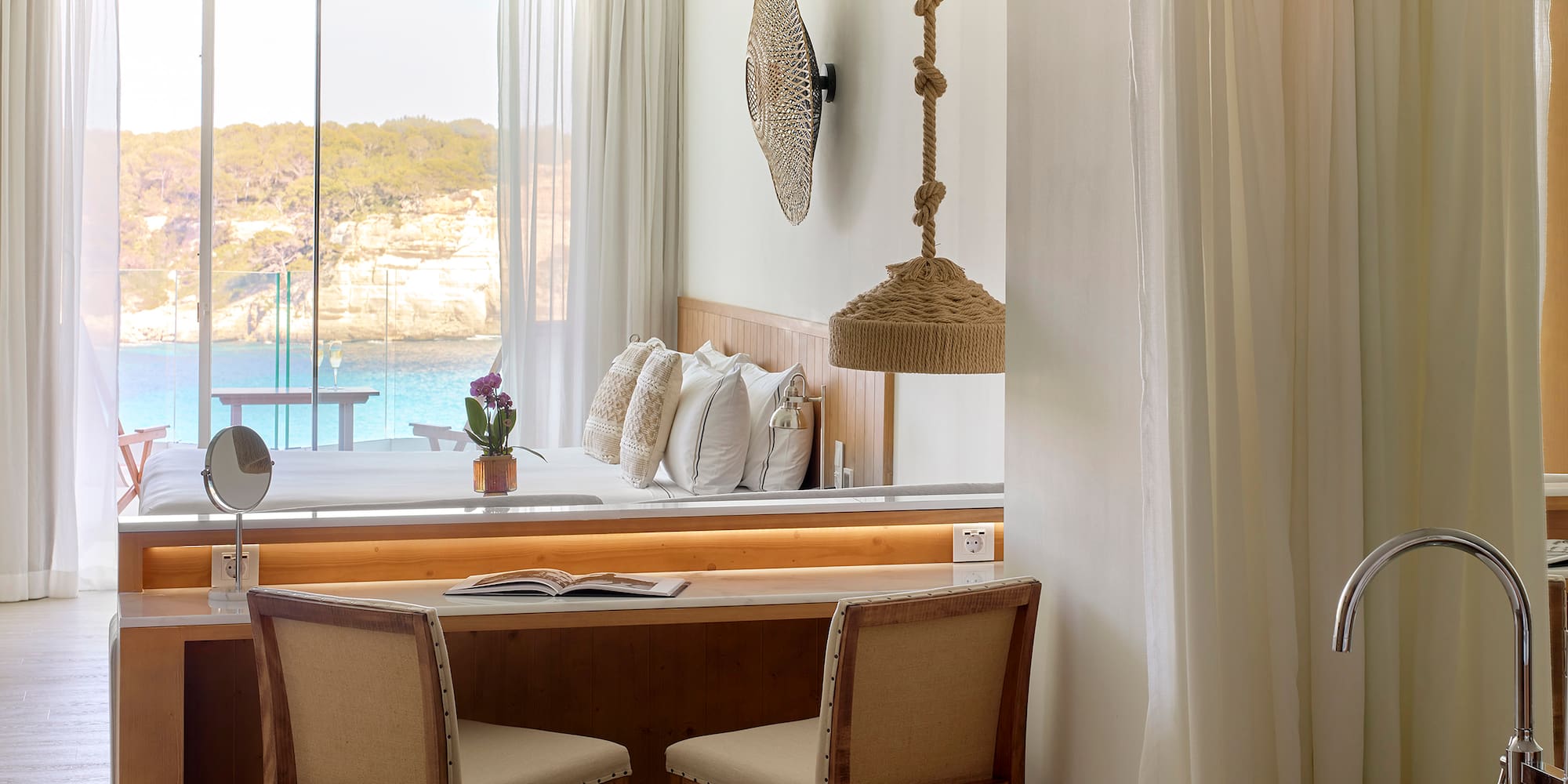 a room with a desk and chairs and a bathtub