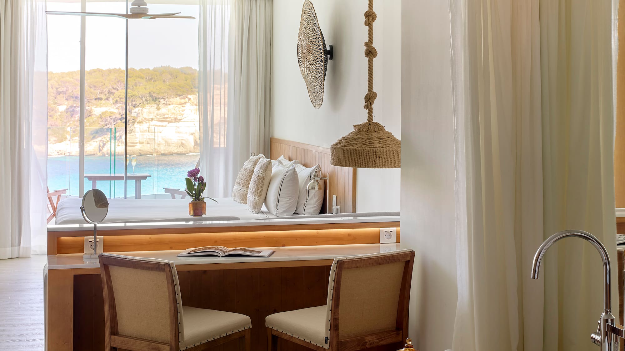 a room with a desk and chairs and a bathtub