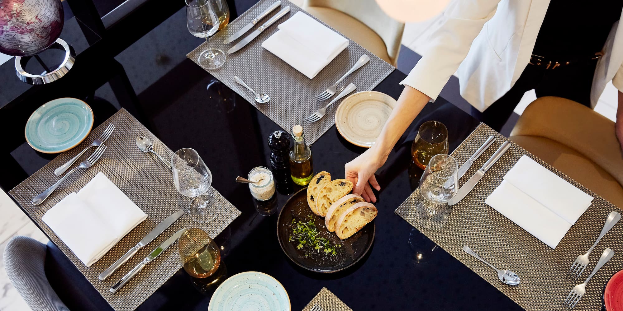 a person serving food at a table