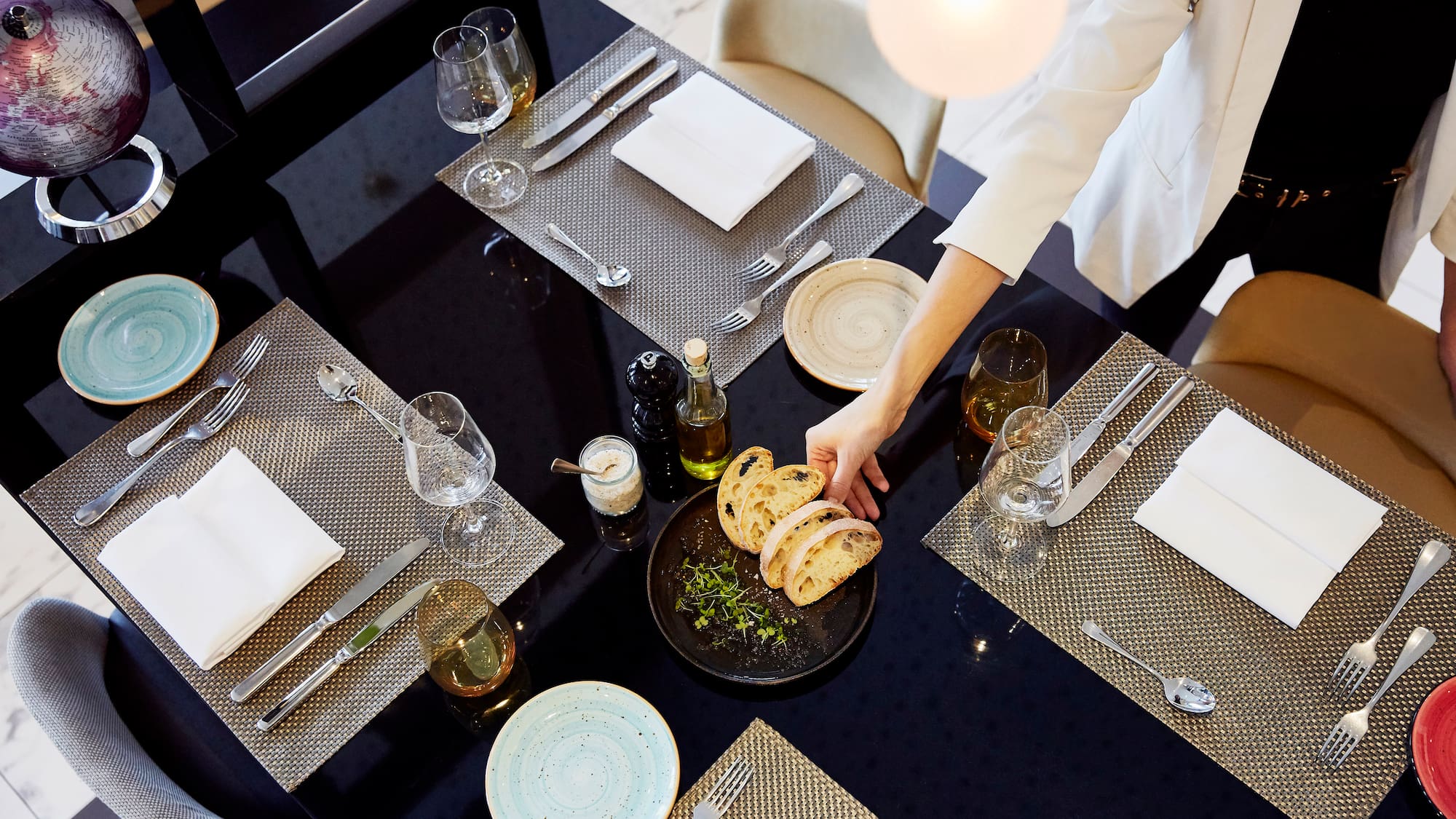 a person serving food at a table