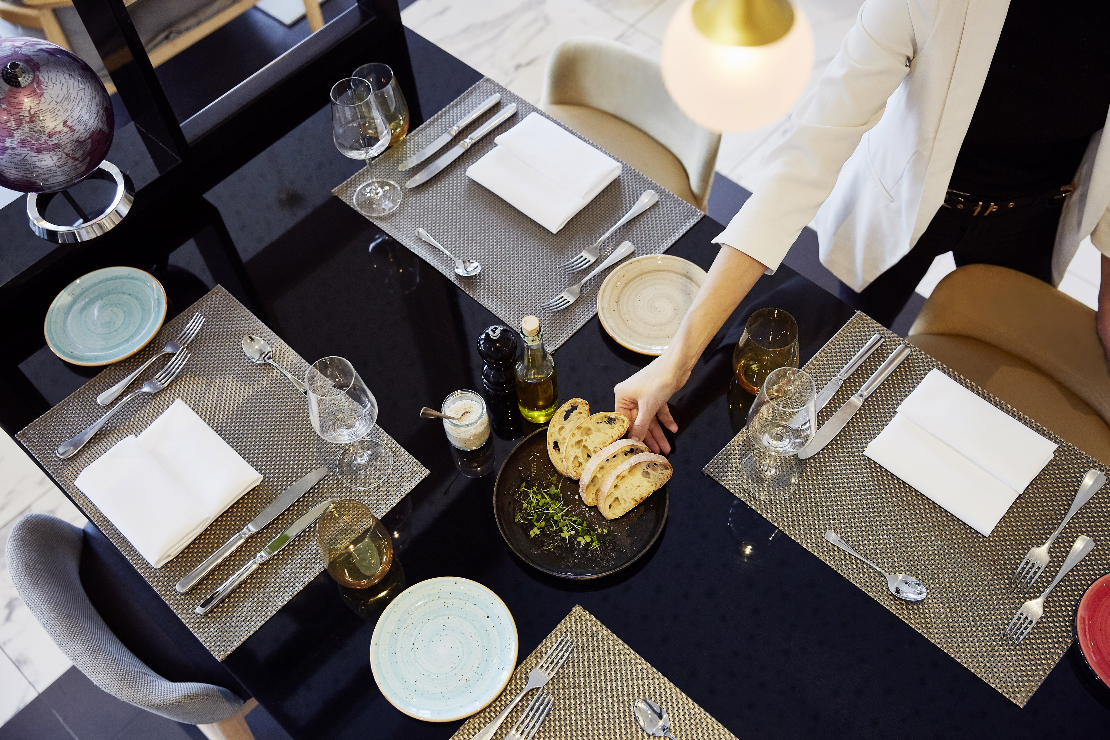 a person serving food at a table