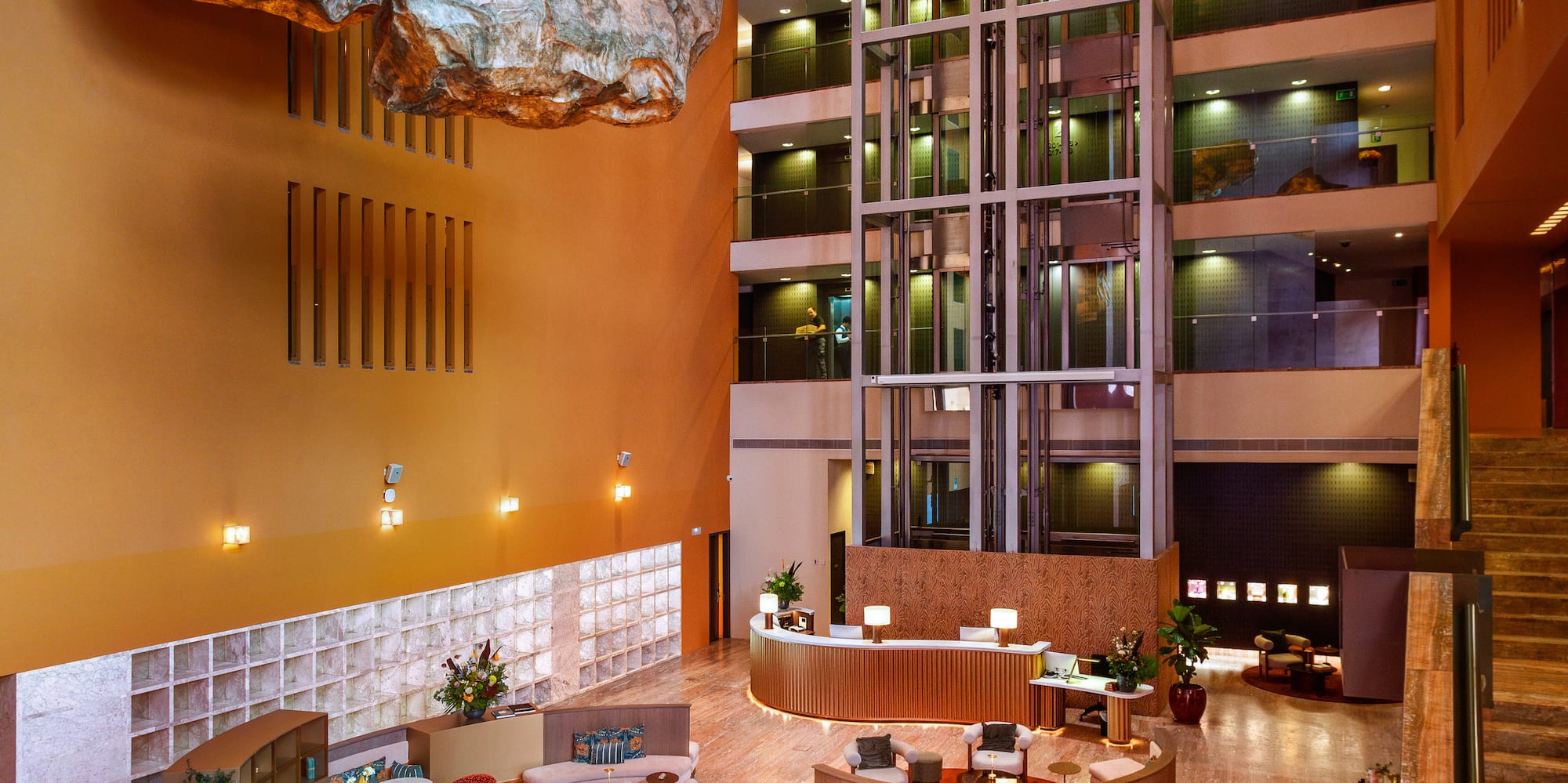 a lobby with a large rock ceiling