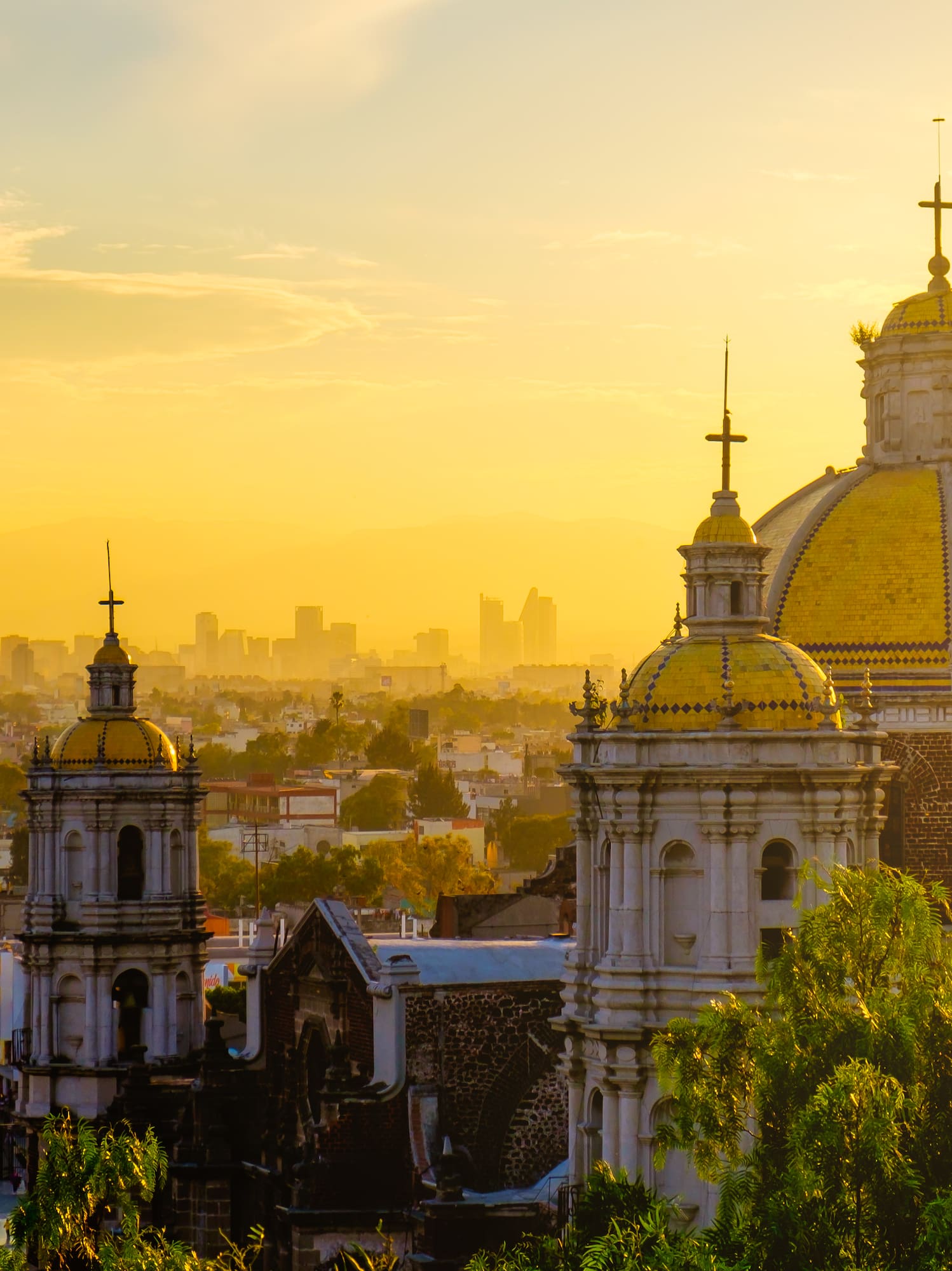 a city with a large building with a yellow dome