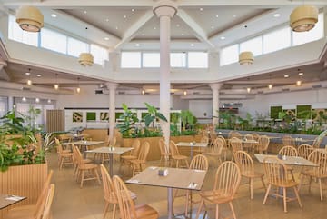 a room with tables and chairs